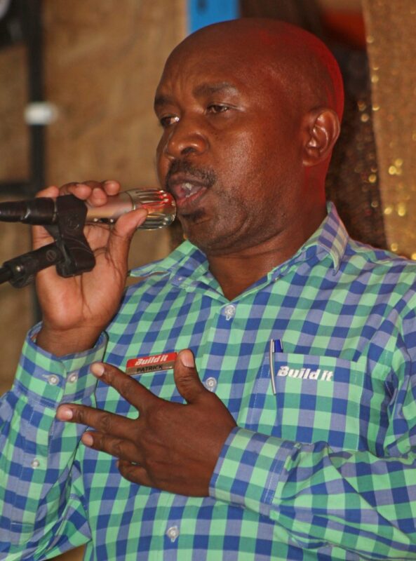 A Build It Plus Newcastle employee is photographed giving a speech during the 25 year celebration gala eveneing.