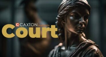 Lady of Justice statue with the words CAXTON court.