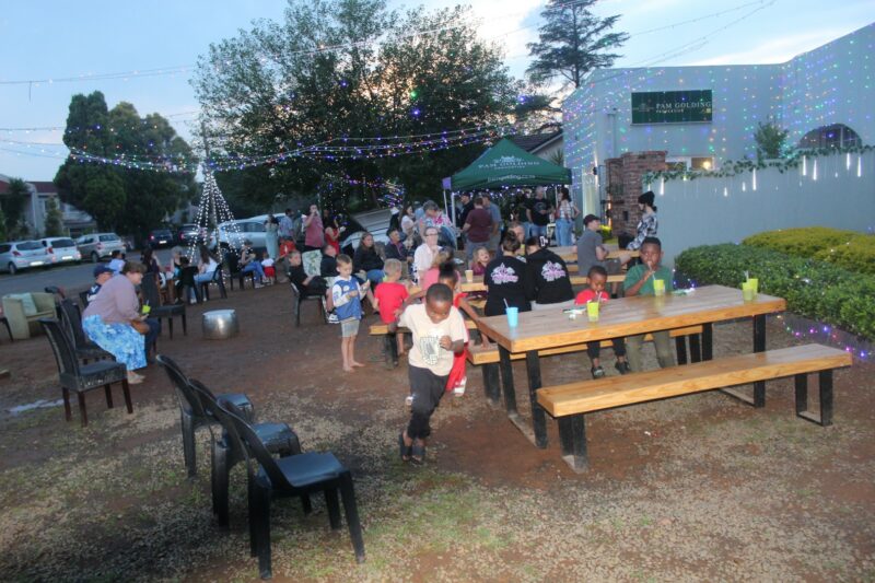 A group of people attending a Christmas lights evening at Pam Golding Properties Newcastle.