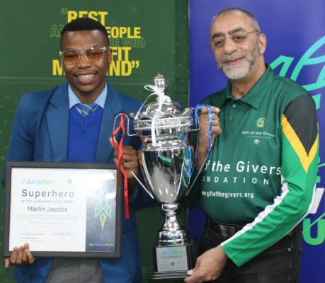 On the photo is Marlin Jacobs receiving are Superhero award from Dr Sooliman 