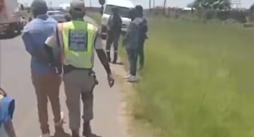 A GROUP OF LAW OFFICIALS ARREST A TAXI DRIVER IN NEWCASTLE, KZN.