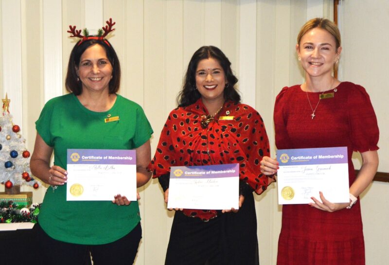 Several people receiving certificates during the Newcastle Lions Club Induction evening at the Newcastle Club on Bird Street.