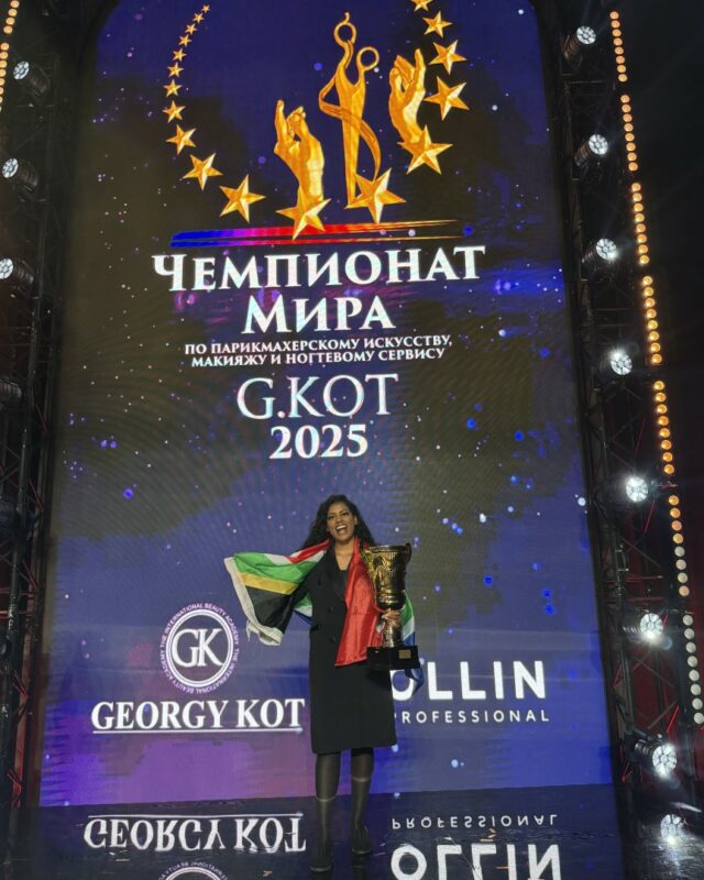 Newcastle hairstylist, Estelle Chetty waves her South African Flag proudly at the World Hairstyling Championships which was hosted in Russia.