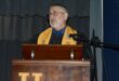 Image of Andries Gregory retiring teacher in academic gown.