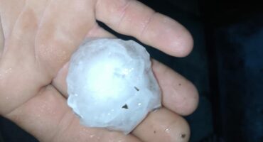 Photo of hail in Glencoe in a person's hand.