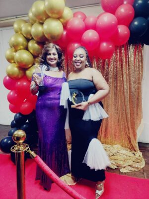 Photos of formally dressed ladies at the Her Foundation awards.