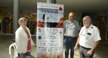 Image of Dundee Moth members selling poppy flowers for Rememberance Day.