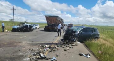 Image of crash scene on R34, two cars collided head-on with a truck passing by.