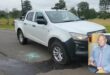 Two images compiled together. One image is of a white doublecab Isuzu bakkie, riddled with bullet holes and the second is of a municipal official from Newcastle Municipality.
