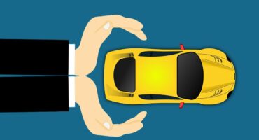 Illustration shows hands protecting a yellow car from above