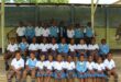 Image of group of grade 1 learners dressed in blue and white school uniform.