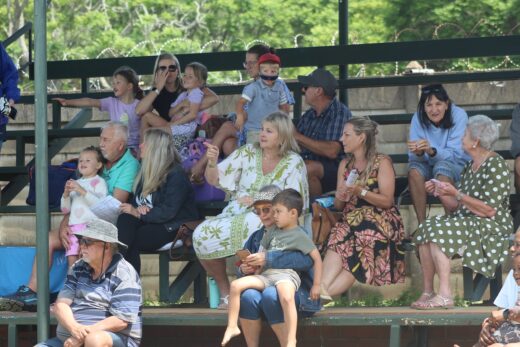 Image of a crowd sitting on the stands watching the swimming events.