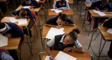 A classroom filled with students writing exams.