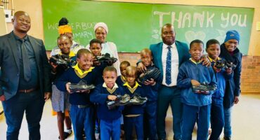 An image of Wonderboom Primary School learners as they received a boost through a donation of more than 46 pairs of new school shoes.