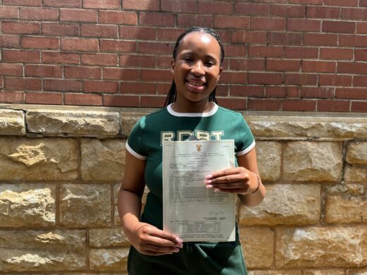 An image of Amahle Ntanzi a matric learner from Vryheid High School, holding her grade 12 statement after the results were released.