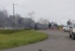 Image of burning tyres blocking entrance to Sithembile, Glencoe.