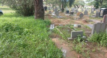 Image of pollution seeping on to gravestones.