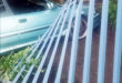 Image of a car hitting a pallisade fencing.