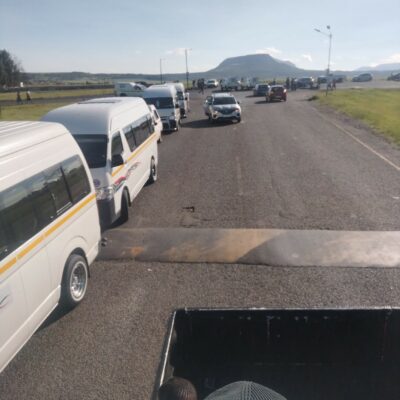 Image of taxi vehicles stuck in traffic near Glencoe.