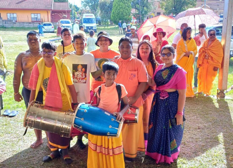A group of children dressed in cultural attire posing at the Thaipoosam Kavady 2026 in Newcastle.