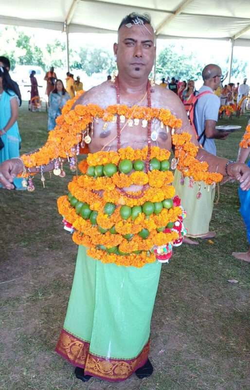 A man dressed in cultural attire posing at the Thaipoosam Kavady 2026 in Newcastle.