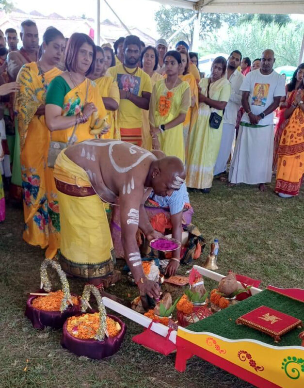 A group of women dressed in cultural attire posing at the Thaipoosam Kavady 2026 in Newcastle.