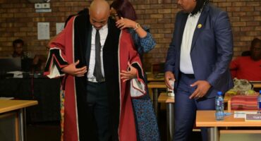 Newcastle Deputy Mayor Andile Nkosi being sworn into office by Newcastle Mayor Xolani Dube.