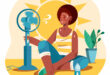 Illustration of a person cooling down indoors during extreme heat, sitting on the floor beside a fan with a large sun behind them, sweating, with a bottle of water nearby and a plant in the background.