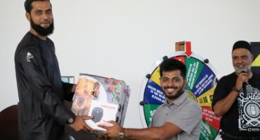 Customer receives prize during Devland Imphupu Wholesalers event.