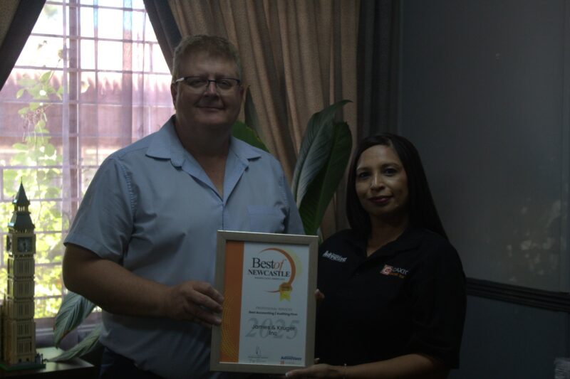 One person receiving a certificate from a Caxton Employee.