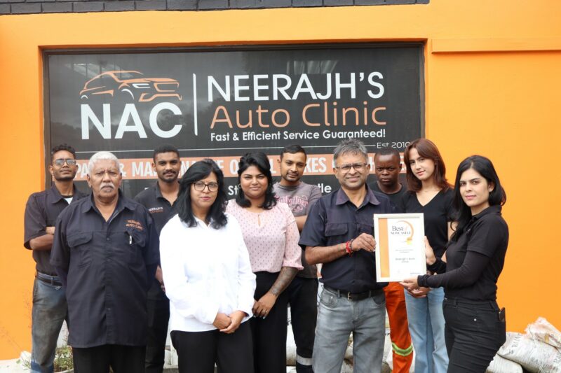 A group of people holding their awards certificate for the Best of Newcastle Readers Choice Awards.