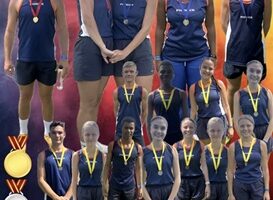 Image of young athletes with their medals on an orange background.