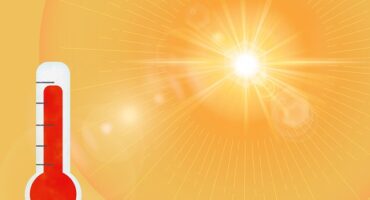 Image of sun and thermostat.