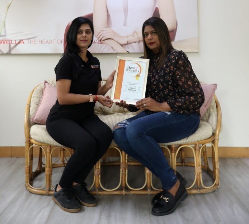 One person receiving a certificate from a Caxton Employee.