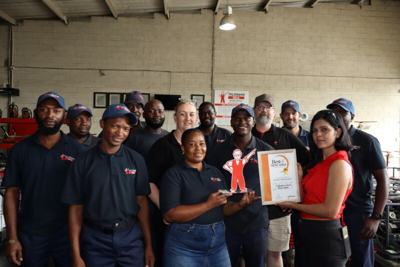 A group of people holding their awards certificate for the Best of Newcastle Readers Choice Awards.
