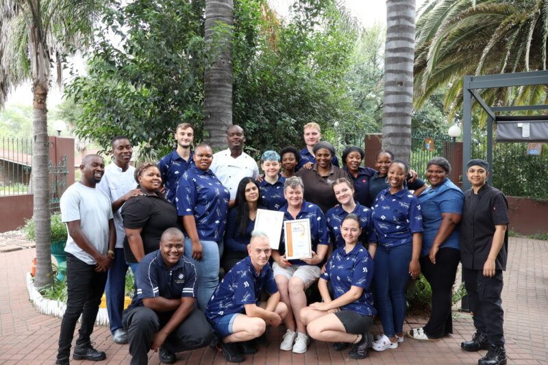 A group of people holding their awards certificate for the Best of Newcastle Readers Choice Awards.