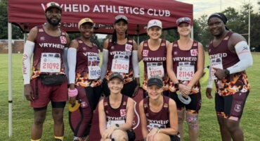 Image of male and female athletes dressed in maroon athletic gear.