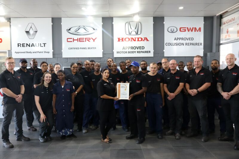A group of people holding their awards certificate for the Best of Newcastle Readers Choice Awards.