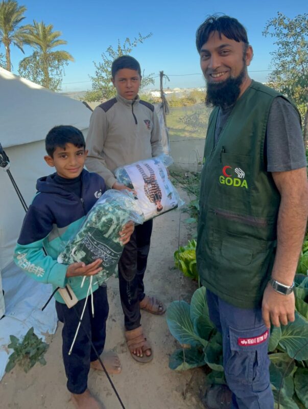 Mahomed Zahir Haniff is photographed with many children living in Gaza.