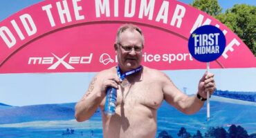 Image of Braam Botes at the finishing line of the Midmar Mile.