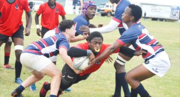 Image of DHS boy scoring a try in a rugby match.