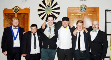 Image of Dundee Round Table members next to each other dressed in tuxedos.