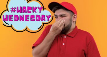 Young delivery man in red uniform and cap closing nose with fingers suffering from stench. There is #Wacky Wednesday written in a blue cloud with a black boarder.
