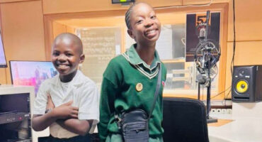 An image of two learners from Harpo Primary School at the Ukhozi FM radio station in Durban. They were invited to recite their poems live at the SABC studios.