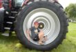 Image of a little boy sitting in a large tractor tyre in Dundee.