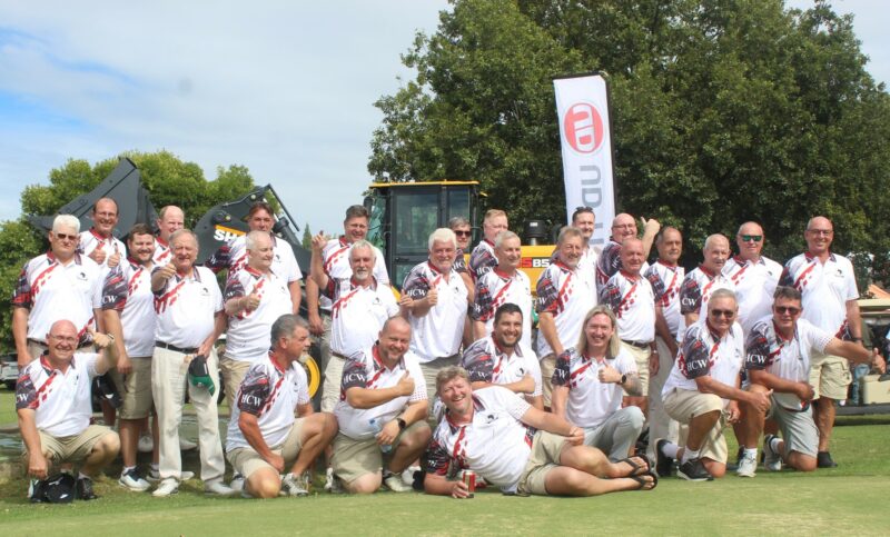 A group of golfers are posing for a photo at the Newcastle Golf Club.