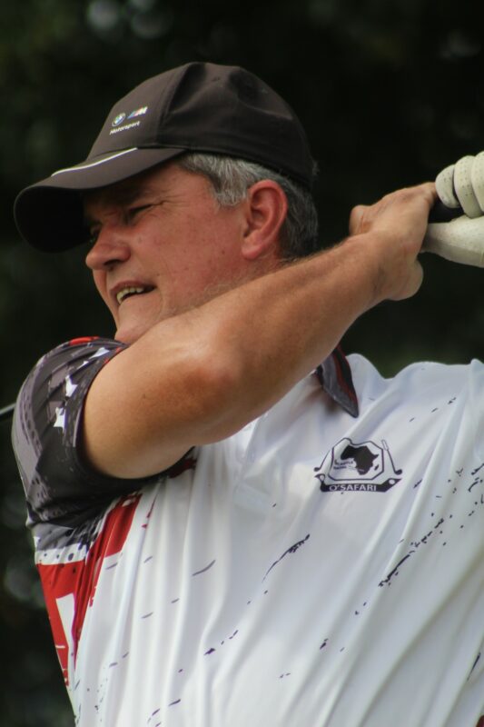 A golfer is photographed teeing off at the Newcastle Golf Club.
