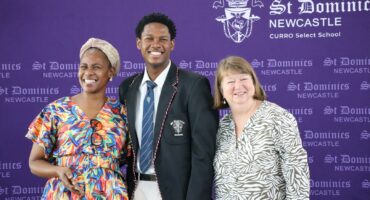 School leaders and pupil pose at St Dominic’s ceremony