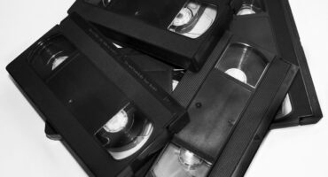 Four black VCR tapes