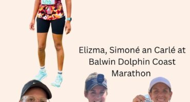 Image of four runners holding their medals.